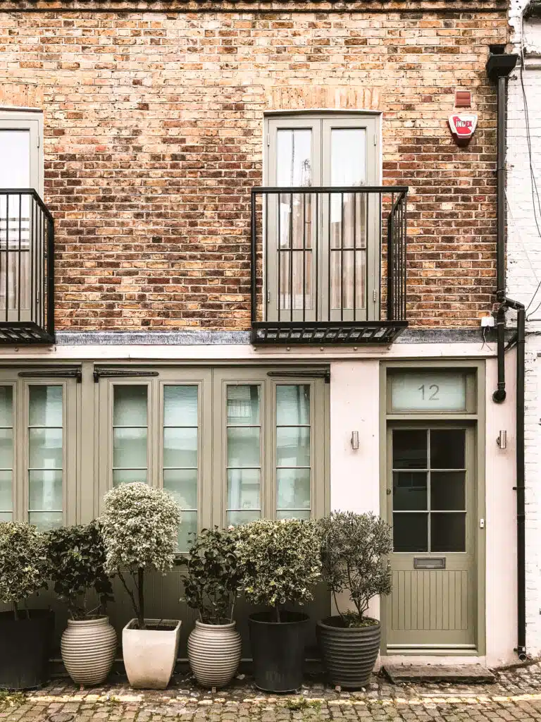 Charming residential property in London featuring modern balconies and lush greenery, ideal for short-term lets. MX Lettings Property Managers London